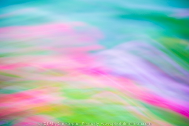 A very colorful abstract image, with red, pink, green, blues and purple