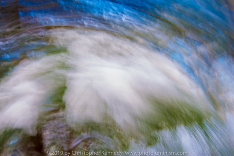 Clouds, greenery and blue sky seem to swirl past the eye