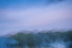 Rough Sea - clouds seem to form above rough waves. Mostly blues.