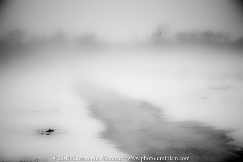 Snow melt run off in mist B&W