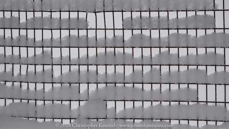 Rectangle wire fence with snow, Wide angle
